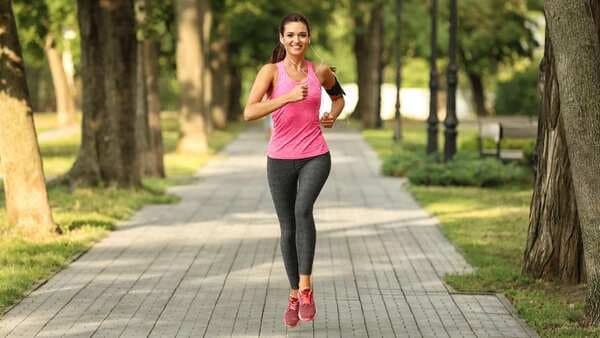 Why must women runners be more conscious about calcium intake?