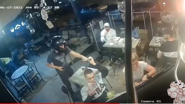 Watch: Man Continues To Eat Chicken Wings While Being Robbed In A Viral Video
