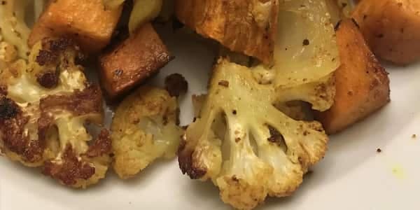 Roasted Curry-Spiced Sweet Potatoes And Cauliflower