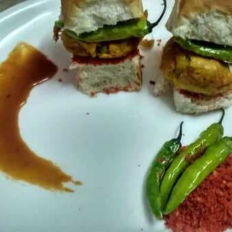 Authentic vada pav with traditional chutney and fried chilles