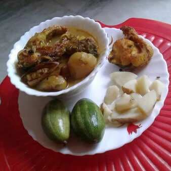 Bengali fish curry with potato and pointed gourd