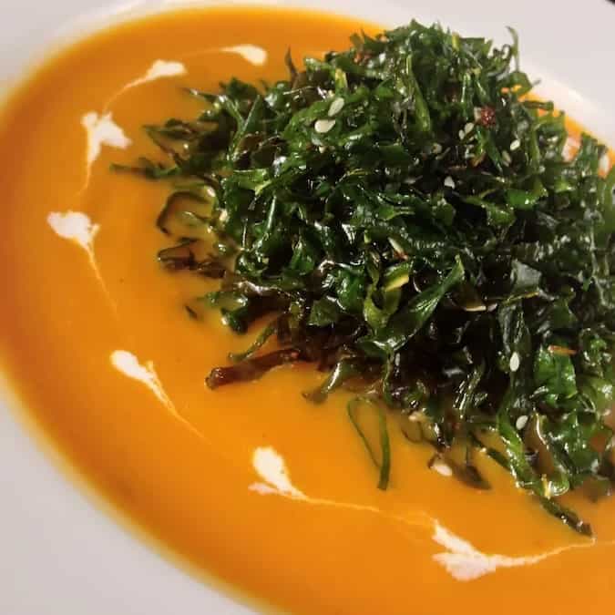 Carrot soup with spinach cracklings