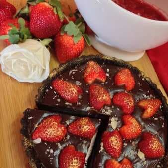 Chocolate and strawberry tart served with strawberry coulis