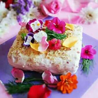 Crazy banana cream cake presenting with edible flowers