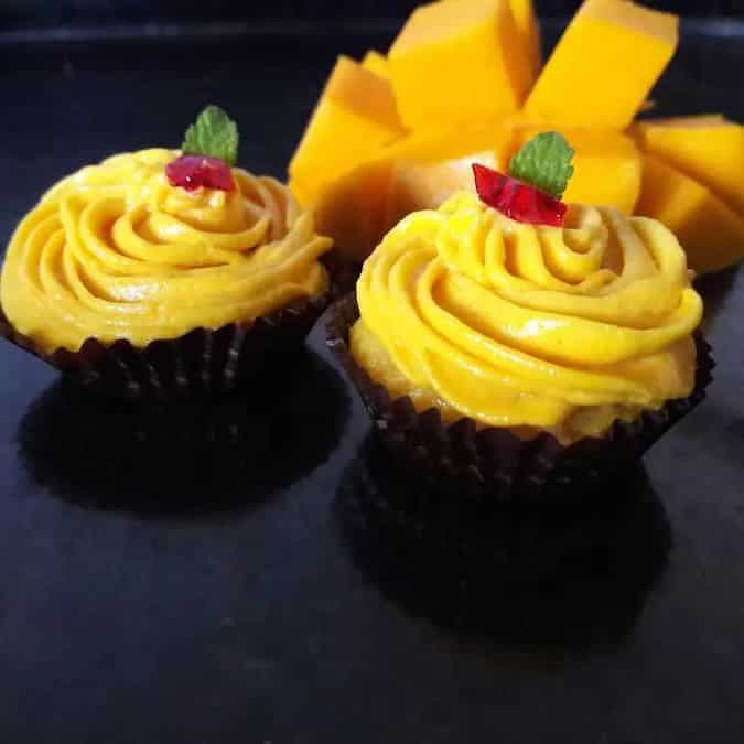 Eggless mini mango cup cakes with mango frosting
