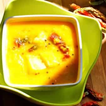 Kacha aamer tok daal (soupy red lentils with raw mango)