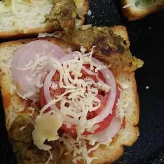 Open onion tomato tikki sandwich