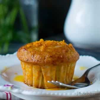 Orange Muffins With Chocochips,  Cherries And Topped With Zesty Orange Glaze