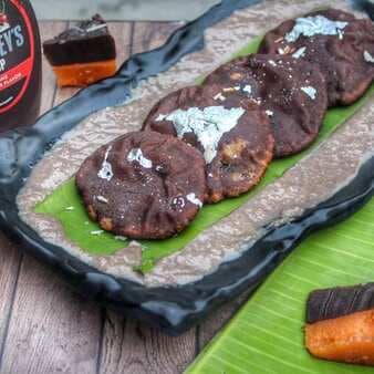 Orange Sheera Stuffed Chocolate Khasta Over Chocolate Rabri With Add-On Mittai