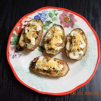 Traditional potato skins filled with cheddar-mozzarella cheeses and chicken