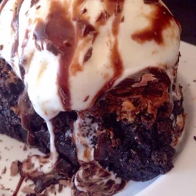 Triple chocolate fudge brownie with vanilla ice cream
