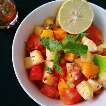 Watermelon pineapple salad with honey lime mint dressing