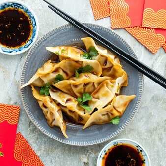 Chicken & Shiitake Dumplings In Tangy Chile-Oil Sauce