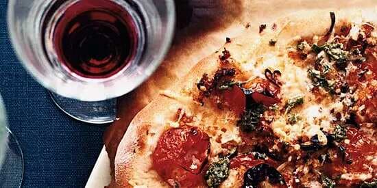 Pizza With Charred Cherry Tomatoes And Pesto