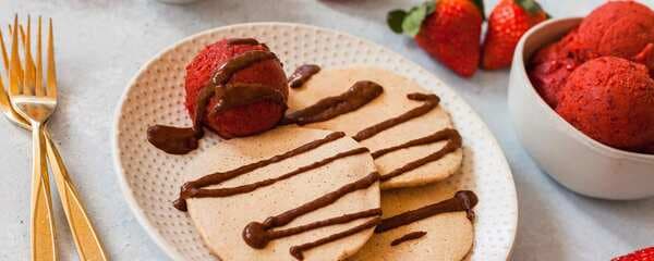 Vanilla Pancakes With Strawberry-Cherry Ice Cream And Warm Chocolate Sauce