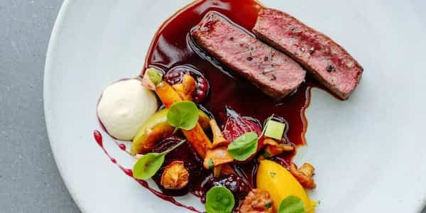 Venison With Roasted Root Vegetables And Red Wine Sauce