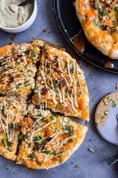 Buffalo Roasted Cauliflower Skillet Pizza With Chipotle Blue Cheese Avocado Drizzle.