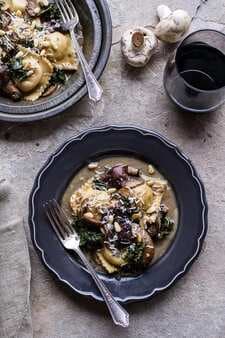 Taleggio Ravioli With Garlicy Butter Kale And Wild Mushroom Sauce + Toasted Pine Nuts.