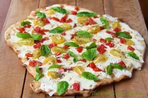 Grilled Pizza Margherita With Heirloom Tomatoes And Roasted Pine Nuts