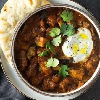Indian Spiced Lamb Curry With Eggplant And Yogurt Sauce