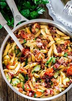 Penne With Prosciutto, Tomatoes And Zucchini