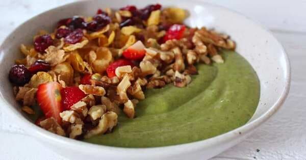 Green Smoothie Bowl With Cereal, Berries, Passionfruit And Toasted Walnuts