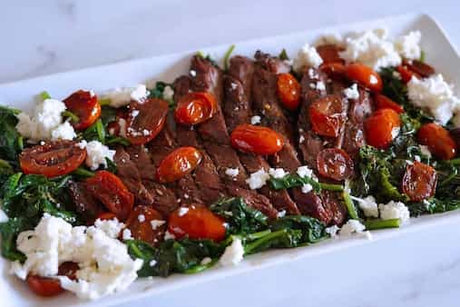 Balsamic Marinated Flank Steak with Sauteed Tomatoes and Spinach