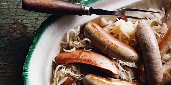 German Sausages With Apples, Sauerkraut, And Onion