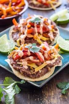 Chipotle Black Bean Tostadas with Onions and Peppers