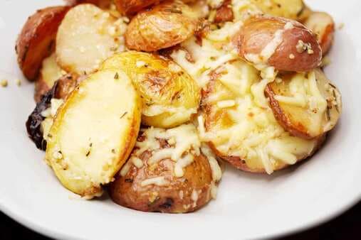 Cheesy Roasted Garlic and Rosemary Potatoes