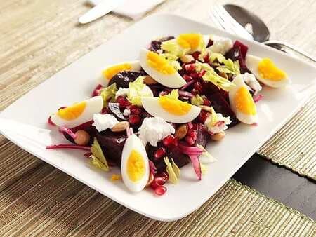 Roasted-Beet Salad With Goat Cheese, Eggs, Pomegranate, And Marcona Almond Vinaigrette