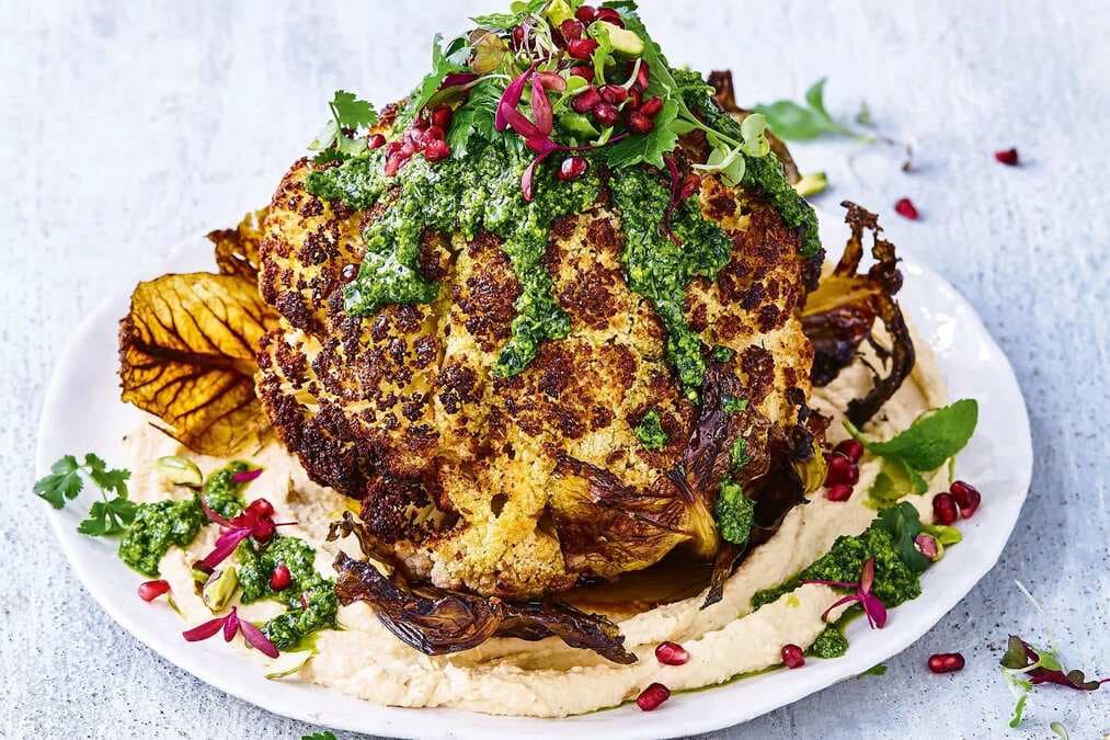 Whole Roasted Cauliflower With Hummus And Green Herb Dressing