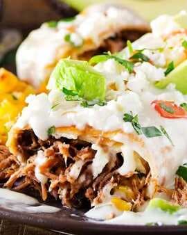 Queso Smothered Beef Chimichangas