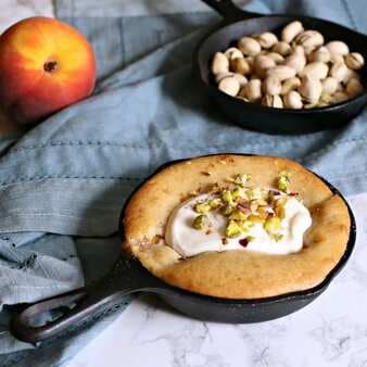Skillet Peach Cobbler With Cardamom Pistachios And Honey