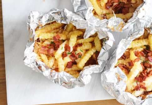 French Fries On Grill With Cheese And Bacon