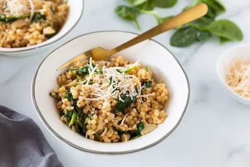 Israeli Couscous Risotto With Spinach And Parmesan Cheese
