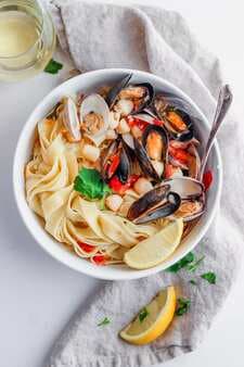 Fettuccine With Mussels, Clams And Bay Scallops In White Wine Sauce