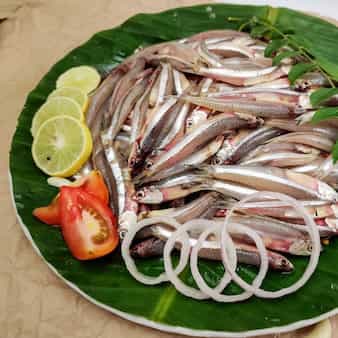 Assamese Delicacy ' Patot Diya Mua Maas'/Fish Cooked In Banana Leaf