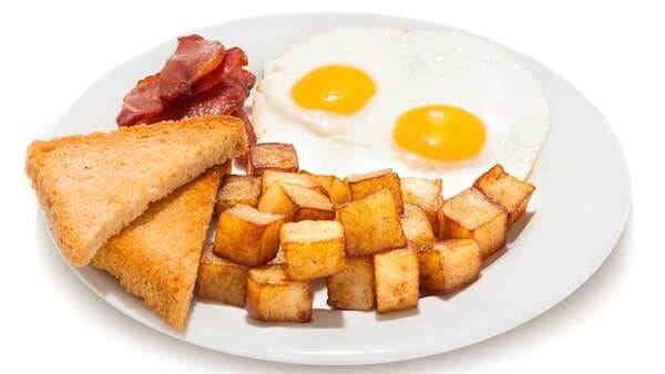 This Canadian Breakfast Is A Yum Combo Of Fries, Bacon, And Eggs
